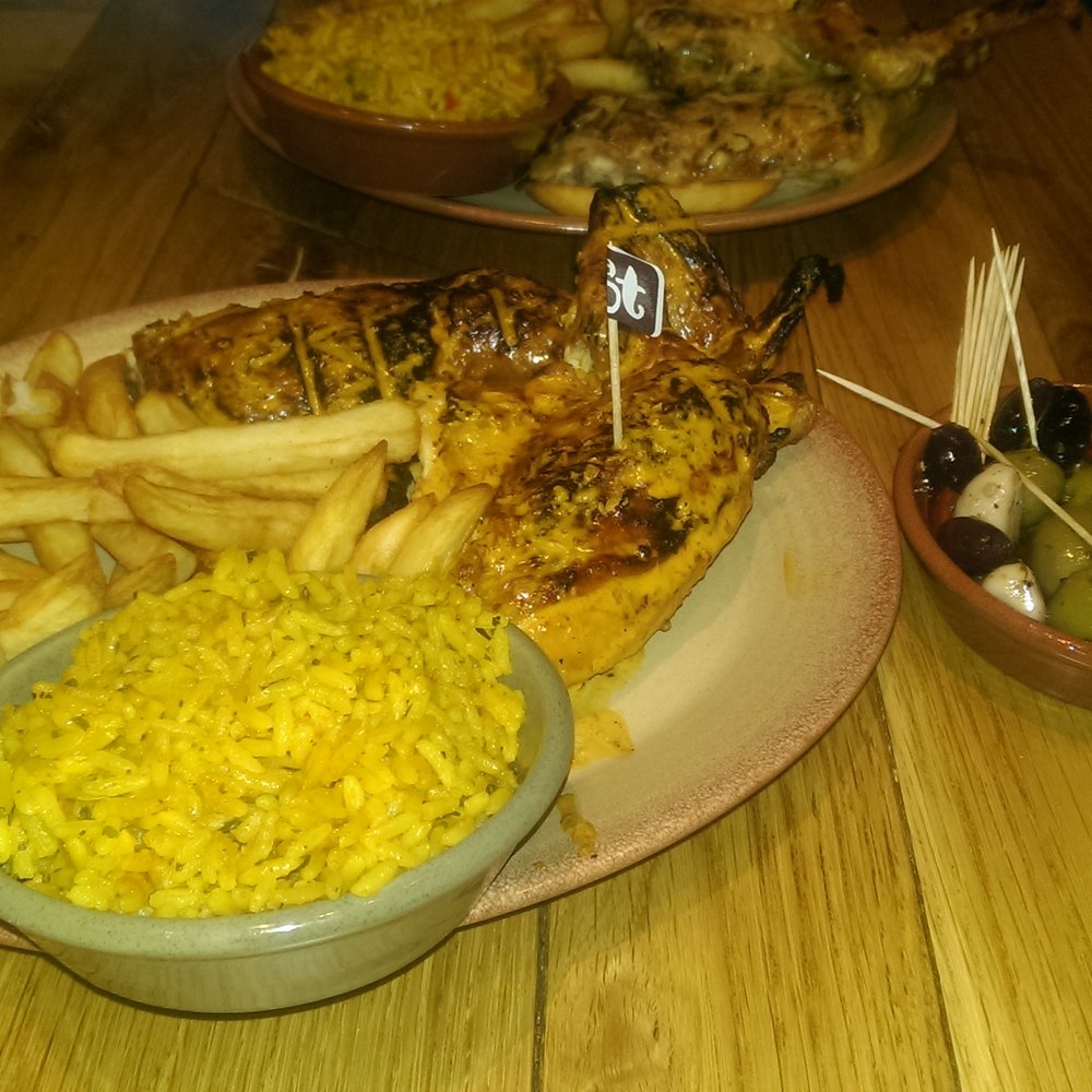 Nando's - Spicy rice, chips, half a chicken extra hot, olives - Chicken Shop Near Me - Bristol, SGC Nando's - Spicy rice, chips, half a chicken extra hot, olives - Chicken Shop Near Me - Bristol, SGC