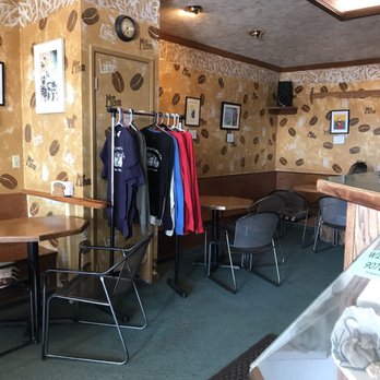 Sleepy Dog Coffee - Your view when you enter. Art hanging on walls and some shirts for sale. - Coffee & Tea Near Me - Eagle River, Alaska
