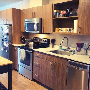 Square One Apartments - Hallway galley style kitchen. We purchased a long, thin island to add to the counter space. Lots of storage. - Apartments Near Me - Seattle, Washington
