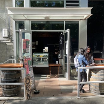 Baiten - Two standing tables on barrels and a stand selling delicious Japanese treats at Tamari Bar. - Desserts Near Me - Seattle, Washington