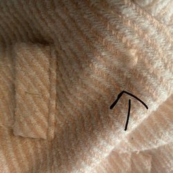 Hillhurst Cleaners - More damage. I do feel the picture's don't clearly due justice showing all the damage, but its throughout the jacket in different spots.