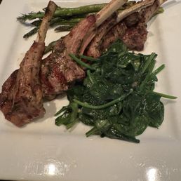 Delicious plate of food. Lamb chops, spinach and asparagus:) - A dish featuring grilled lamb chops, cooked asparagus, and sautéed spinach served on a white square plate.