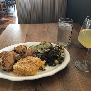 Tupelo Honey Southern Kitchen & Bar - Original Honey Dusted chicken with crispy Brussels and Mac and cheese + Passionfruit mimosa - Southern Near Me - Denver, Colorado Tupelo Honey Southern Kitchen & Bar - Original Honey Dusted chicken with crispy Brussels and Mac and cheese + Passionfruit mimosa - Southern Near Me - Denver, Colorado