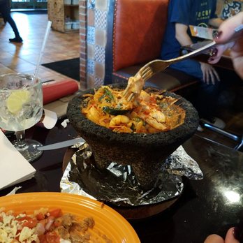 Tres Caminos - Best Tex Mex I've had in a long time! Wife got the volcano (pic) which is just stuffed with all kinds of seafood in a hot stoneware bowl. - Mexican Near Me - Caseyville, Illinois