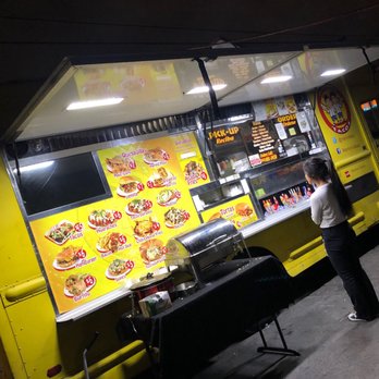 Manny ' s Tacos - woman ordering food from a food truck - Food Trucks Near Me - Long Beach, California