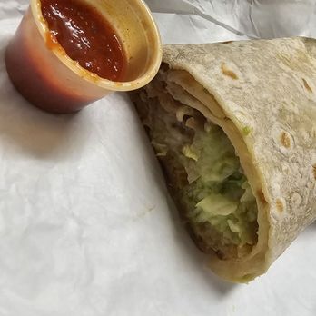 Morenos - a burrito cut in half with sauce - Mexican Near Me - Longview, Washington Morenos - a burrito cut in half with sauce - Mexican Near Me - Longview, Washington