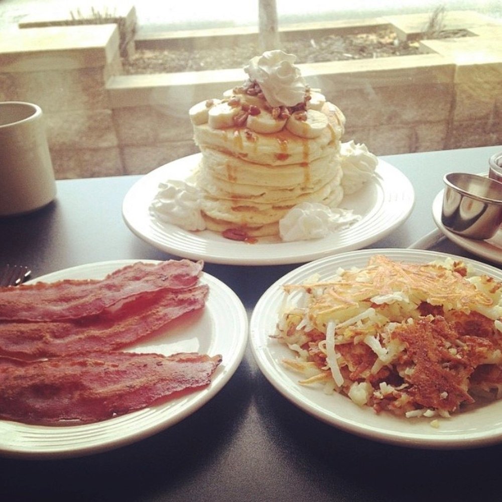 Stacked - Full stack banana nut caramel pancakes with a side of hash browns & turkey bacon. - Breakfast & Brunch Near Me - Oak Lawn, Illinois Stacked - Full stack banana nut caramel pancakes with a side of hash browns & turkey bacon. - Breakfast & Brunch Near Me - Oak Lawn, Illinois