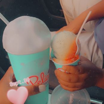Pelican's SnoBalls - a person holding a cup of ice cream - Shaved Ice Near Me - Athens, Georgia Pelican's SnoBalls - a person holding a cup of ice cream - Shaved Ice Near Me - Athens, Georgia
