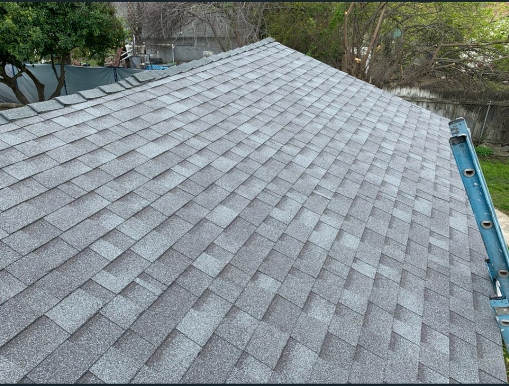 Slide of Trinity Roofing L & R Brothers