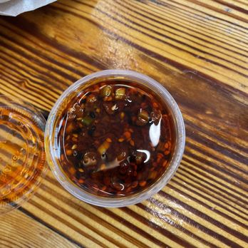 The Dumpling Lady - "Signature" chili oil sauce. - Szechuan Near Me - Charlotte, North Carolina The Dumpling Lady - "Signature" chili oil sauce. - Szechuan Near Me - Charlotte, North Carolina