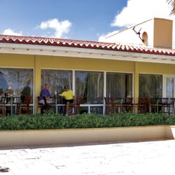 Sunset Grill - Outdoor seating with view of golf course