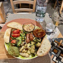 Just Veggie - Appetizer combo with caponata, hummus, a falafel, green salad, sautéed vegetables, some sort of spicy veggie sausage. Yum!