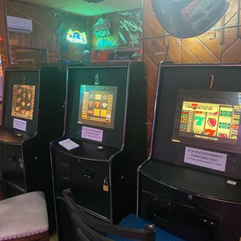 Handlebar & Grill - a row of slot machines - American Near Me - Asheville, North Carolina Handlebar & Grill - a row of slot machines - American Near Me - Asheville, North Carolina