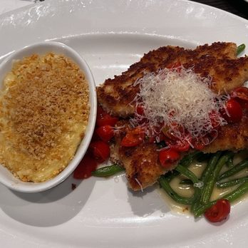 Cooper's Hawk Winery & Restaurant - Prank garlic crusted chicken over a bed of green beans. Cheesy potatoes something on the side Chicken was very delicious. - American Near Me - Cincinnati, Ohio