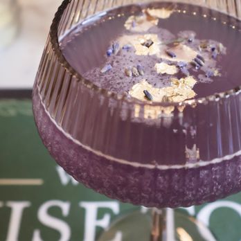 Wise Town Cafe - Miss Violet A floral beauty in a glass, Empress Gin, Soho Lychee, Cointreau, peach, and Giffard Violette come together for a cocktail th - Coffee & Tea Near Me - Ottawa, Ontario