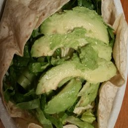 Open burrito bowl - half chicken & half steak. Fresh avocado slices Open burrito bowl - half chicken & half steak. Fresh avocado slices