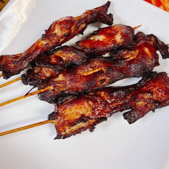 China Moon - skewered meat on a white plate - Szechuan Near Me - Clio, Michigan China Moon - skewered meat on a white plate - Szechuan Near Me - Clio, Michigan