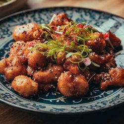 Block Kitchen + Bar - Admiral Sho Cauliflower with marinated and fried cauliflower bites, General Tso sauce, sesame, chili thread.