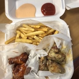 Bbq wings, garlic parmesan wings, fries, ketchup, and "yum yum" sauce