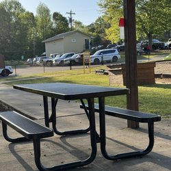 The Playground at Gordon Henry  Park - Picnic shelter and adjoining tables.