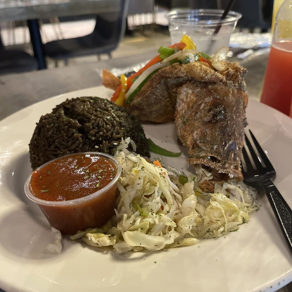 Spice House Lithonia - Port-au-Snapper (whole fried snapper), black rice and pickliz. - Caribbean Near Me - Lithonia, Georgia Spice House Lithonia - Port-au-Snapper (whole fried snapper), black rice and pickliz. - Caribbean Near Me - Lithonia, Georgia