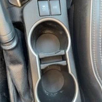 Caliber Collision - Dust inside drink holder - Body Shops Near Me - Tustin, California