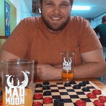 Mad Moon Cider Tap Room - Playing checkers & other board games while cidering it up! - Cideries Near Me - Columbus, Ohio