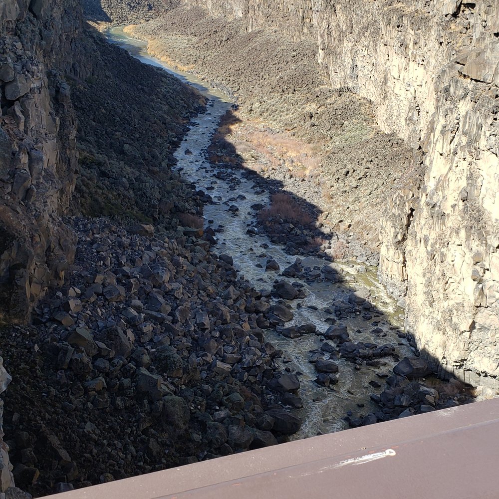 looking downstream from the walking bridge. The waterfall is directly underneath looking downstream from the walking bridge. The waterfall is directly underneath