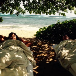 Somaraja - Holistic Massage Therapy on Kauai with Nicole. A relaxed couple gets a beach massage on Kauai. The perfect compliment to a magical honeymoon
