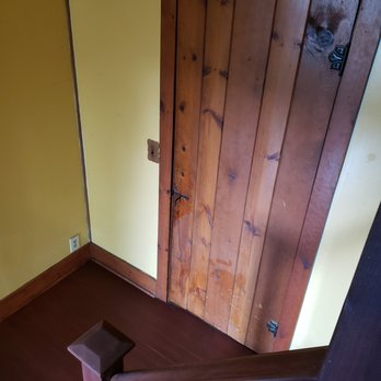 RJ Construction - a wooden door and stairs - General Contractors Near Me RJ Construction - a wooden door and stairs - General Contractors Near Me