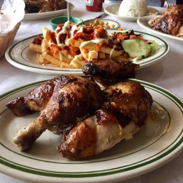 1/4 Rotisserie chicken with loaded fries in the back
