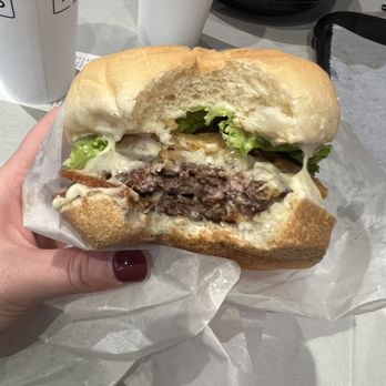 Tonyburgers - Clinton - a hand holding a sandwich - Burgers Near Me - Clinton, Utah Tonyburgers - Clinton - a hand holding a sandwich - Burgers Near Me - Clinton, Utah