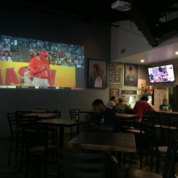Upper90 on College - people sitting at tables in a sports bar - Sports Bars Near Me - Fort Worth, Texas