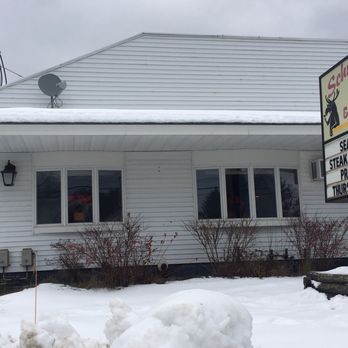 Schmooses - the front of a restaurant in the snow - Seafood Near Me - Jackman, Maine