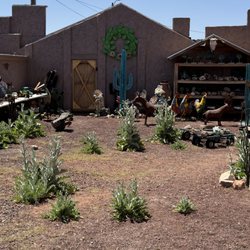 Rocks & More - Outside area with some art pieces and portapotties