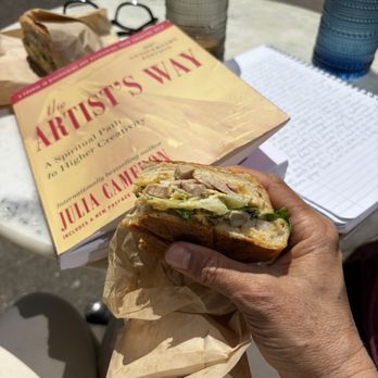 Coquine Market - An iced latte and the Caesar salad panini in the springtime sunshine. - Farmers Market Near Me - Portland, Oregon