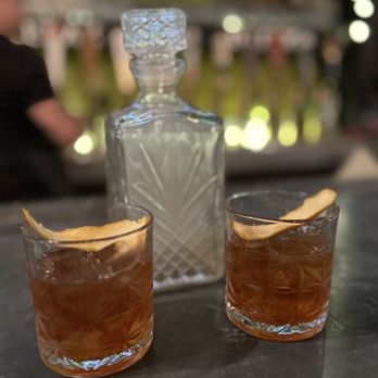 Red Table - two glasses of alcohol and a decanter - Gastropubs Near Me - Huntington Beach, California Red Table - two glasses of alcohol and a decanter - Gastropubs Near Me - Huntington Beach, California