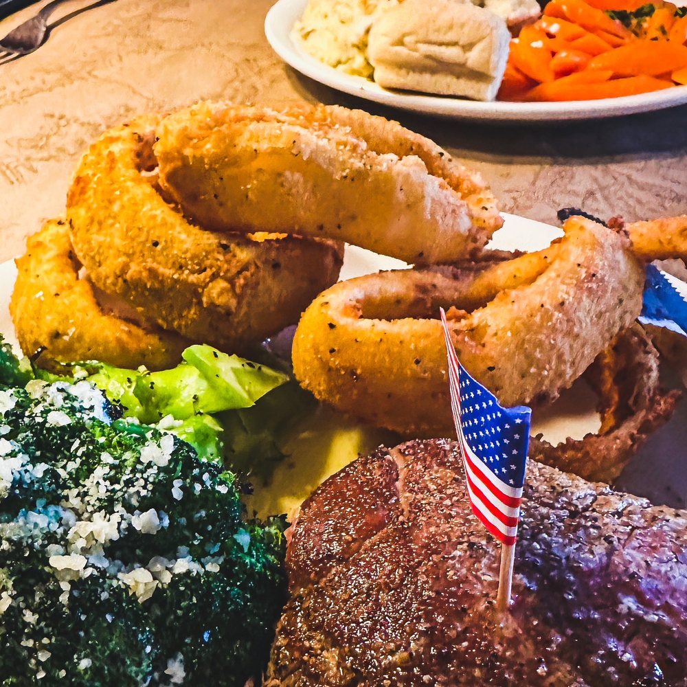 Bison Filet with a side of onion rings and broccoli. Bison Filet with a side of onion rings and broccoli.