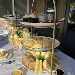 carrot cake, raspberries, coconut flan, two types of scones and three types of yummy sandwiches
