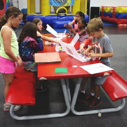 Puzzles Academy Child Development Center - Summer Campers building Lego creations