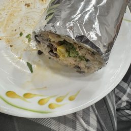 Grilled chicken burrito ( I cut it in half ) Grilled chicken burrito ( I cut it in half )