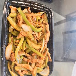 Shredded pork with chili pepper. Disproportionally between meat and peppers and onions. Shredded pork with chili pepper. Disproportionally between meat and peppers and onions.