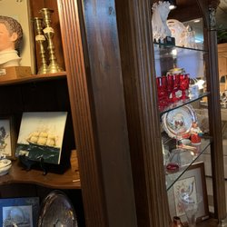 Dave Murray Estate Sales - Cabinets with antique plates and pictures.
