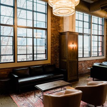 Pullman Standard - a living room with a chandelier - Cocktail Bars Near Me - Nashville, Tennessee Pullman Standard - a living room with a chandelier - Cocktail Bars Near Me - Nashville, Tennessee