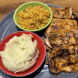 Nando's - Peri-Peri chicken (4 boneless chicken thighs) with mashed potatoes and spicy rice
