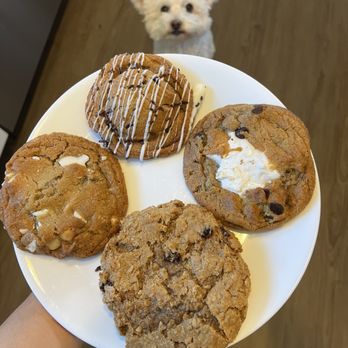 Maya's Cookies - Oreo (top), white chocolate macadamia (left), s'more (right), and wheat free drunken grandma (bottom). - Desserts Near Me - San Diego, California Maya's Cookies - Oreo (top), white chocolate macadamia (left), s'more (right), and wheat free drunken grandma (bottom). - Desserts Near Me - San Diego, California