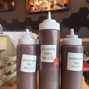 Bubba J's BBQ - The three types of hot sauce available. I tried all three very flavorful and not too hot. - Barbeque Near Me - East Wenatchee, Washington