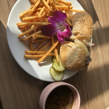 Morning Crumbs - French Dip with French fries and au jus 3 pickle slices and a flower - Breakfast & Brunch Near Me - Mukwonago, Wisconsin Morning Crumbs - French Dip with French fries and au jus 3 pickle slices and a flower - Breakfast & Brunch Near Me - Mukwonago, Wisconsin