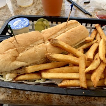 Rick's On the River - 1/2 Ricks Famous Fish Sandwich - New American Near Me - Tampa, Florida Rick's On the River - 1/2 Ricks Famous Fish Sandwich - New American Near Me - Tampa, Florida