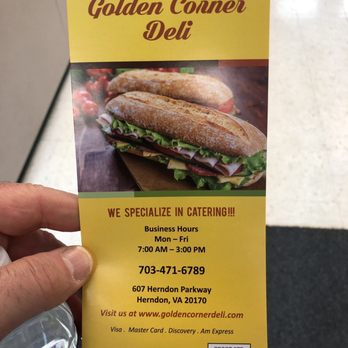 Golden Corner Deli - a hand holding a sandwich - Salad Near Me - Herndon, Virginia Golden Corner Deli - a hand holding a sandwich - Salad Near Me - Herndon, Virginia